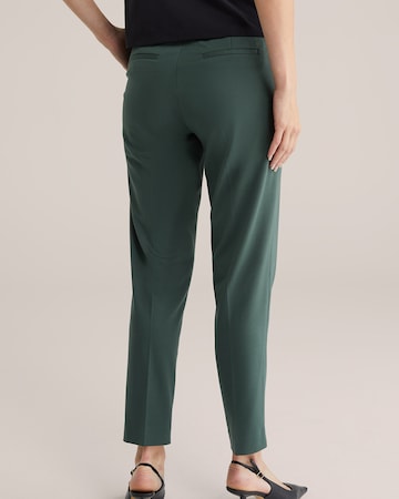 Slimfit Pantaloni con piega frontale di WE Fashion in verde