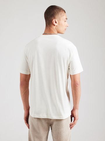 Tricou de la EA7 Emporio Armani pe bej