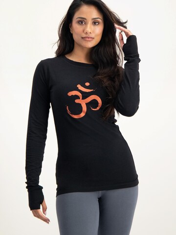 Urban Goddess Yoga & Activewear Sporttop 'Karuna OM Yoga & Pilates' in Schwarz