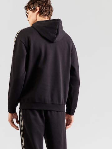 PUMASweater majica 'Ess Elevated Tape' - crna boja