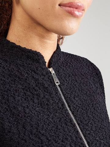 ABOUT YOU Neuletakki 'Saphia' värissä musta