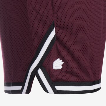 UNDER ARMOUR Loosefit Sportbroek 'Curry' in Rood