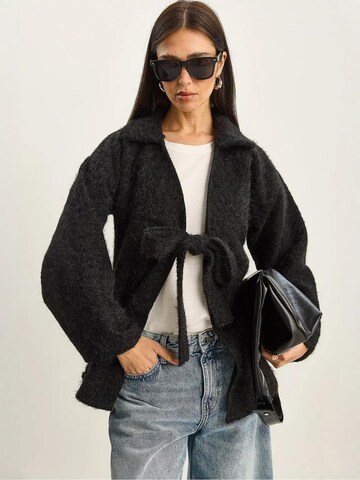 Bianco Lucci Knit Cardigan in Black: front