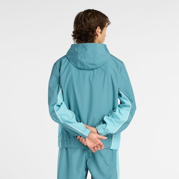 Veste mi-saison 'Trackside Woven Jacket' new balance en bleu