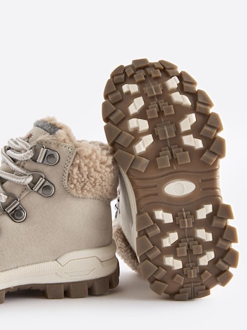 Bottes Next en beige