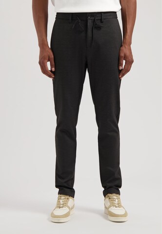 Dstrezzed Tapered Trousers in Black: front