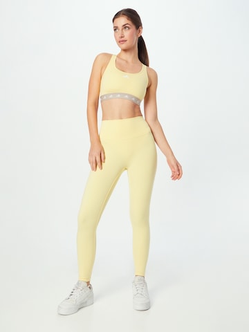 Skinny Pantaloni sportivi 'Studio' di ADIDAS SPORTSWEAR in giallo