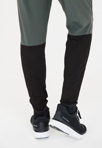 ENDURANCE Tapered Sports trousers 'Jeen' in Green
