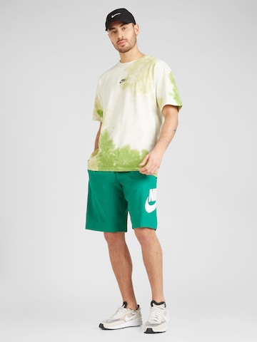 Nike Sportswear Loose fit Trousers 'CLUB' in Green
