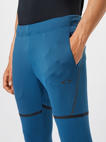 Effilé Pantalon de sport OAKLEY en bleu