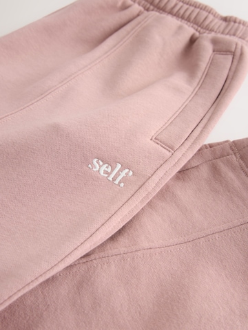 self. Tapered Hose in Pink