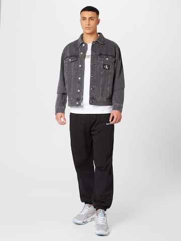 Calvin Klein Jeans تابيرد سراويل بلون أسود