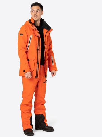 Superdry Snow Normalny krój Spodnie outdoor w kolorze pomarańczowy