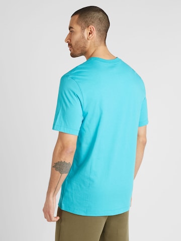 Nike Sportswear T-shirt 'Swoosh' i blå
