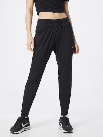 NIKE Tapered Sports trousers in Black: front