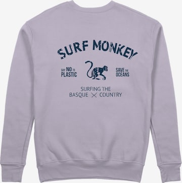 Surf MonkeySweater majica 'Rette das Ozean' - ljubičasta boja: prednji dio