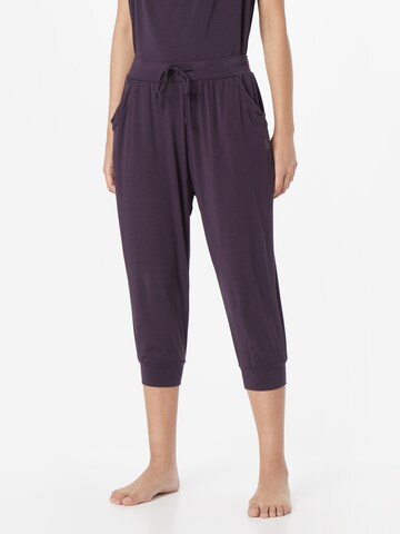 CURARE Yogawear Tapered Workout Pants in Purple: front