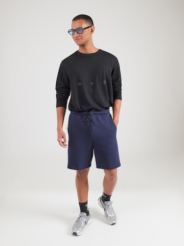 Nike SportswearLoosefit Hlače 'TECH FLC' - plava boja