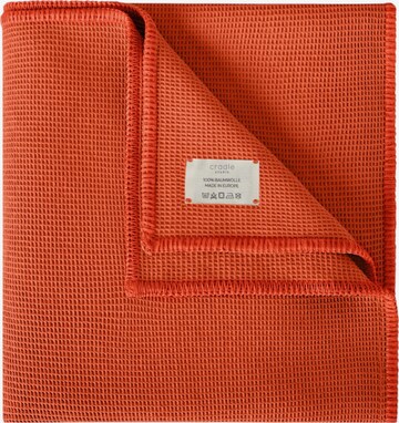 Cradle Studio Blankets in Orange: front