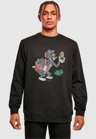 ABSOLUTE CULT Sweatshirt 'Tom And Jerry - Tom Egg Hunt' in Zwart: voorkant