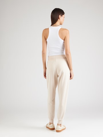 ABOUT YOU Tapered Trousers 'Teena' in Beige