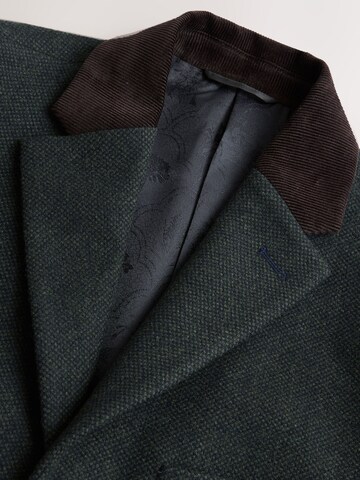 Next Mantel in Grün