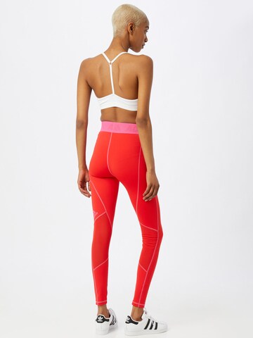 ADIDAS SPORTSWEAR - Skinny Calças de desporto em vermelho