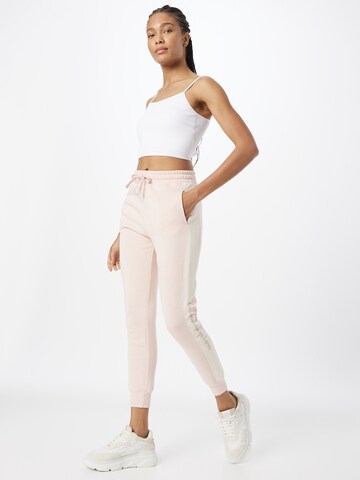 Champion Authentic Athletic Apparel Tapered Broek in Roze