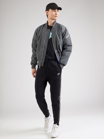 Nike Sportswear Tapered Trousers in Black