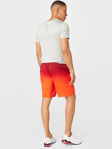 regular Pantaloni sportivi di PUMA in arancione