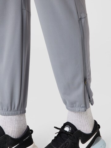 NIKE Zúžený Sportovní kalhoty – šedá