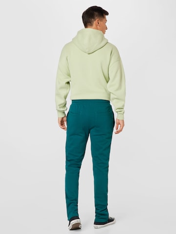 Urban Classics Normalny krój Spodnie w kolorze zielony