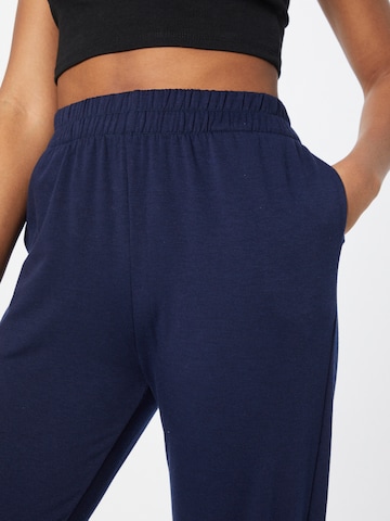 Tapered Pantaloni sportivi di Onzie in blu