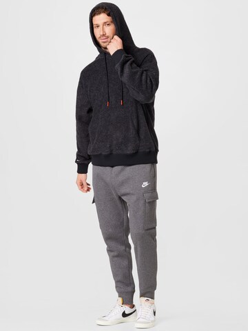 Tapered Pantaloni cu buzunare de la Nike Sportswear pe gri