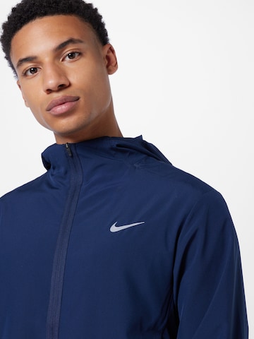 NIKE Trainingsjack 'Form' in Blauw