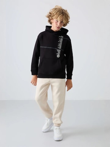 Tommy Life Broek 'TOMMY Kinder Jogginghose' in Beige