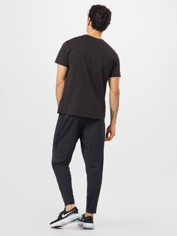 NIKE Regular Workout Pants 'Phenom' in Black