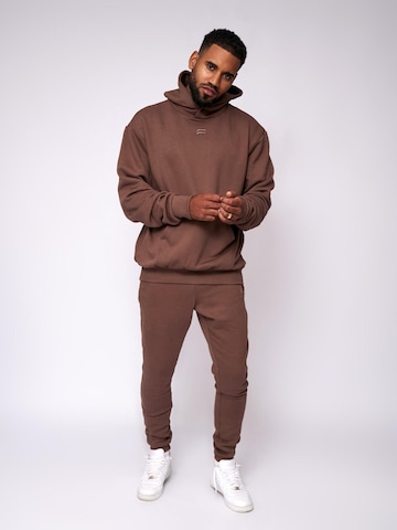 Pullover 'Essential Oversized Hoodie' di Fortex Fitness in marrone