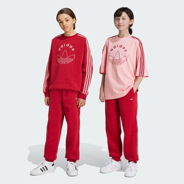 ADIDAS ORIGINALS Tapered Trousers in Red: front