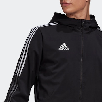 Skinny Jachetă de trening 'Tiro 21' de la ADIDAS SPORTSWEAR pe negru