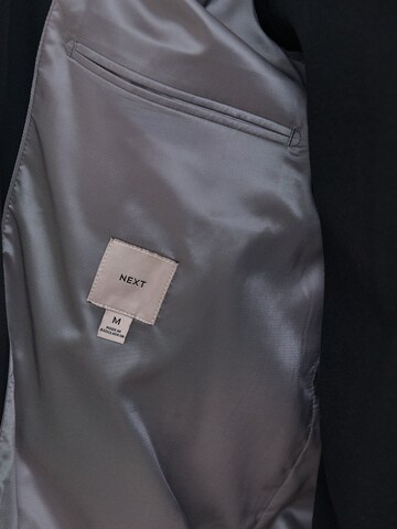 Next - Chaqueta de entretiempo 'Motionflex' en negro