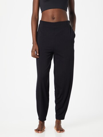 CURARE Yogawear Zúžený Sportovní kalhoty – černá: přední strana