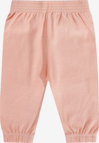 JACKY Tapered Pants in Orange: front