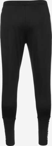 Effilé Pantalon de sport NIKE en noir