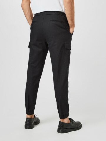 BURTON MENSWEAR LONDON Tapered Hose in Schwarz