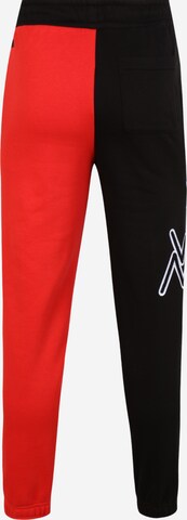 Effilé Pantalon de sport PUMA en rouge