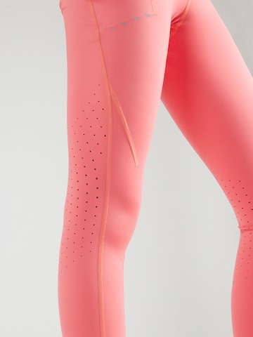 NIKE Kitsas Spordipüksid 'SWIFT', värv oranž