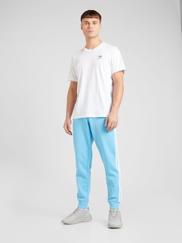 Tapered Pantaloni di ADIDAS ORIGINALS in blu