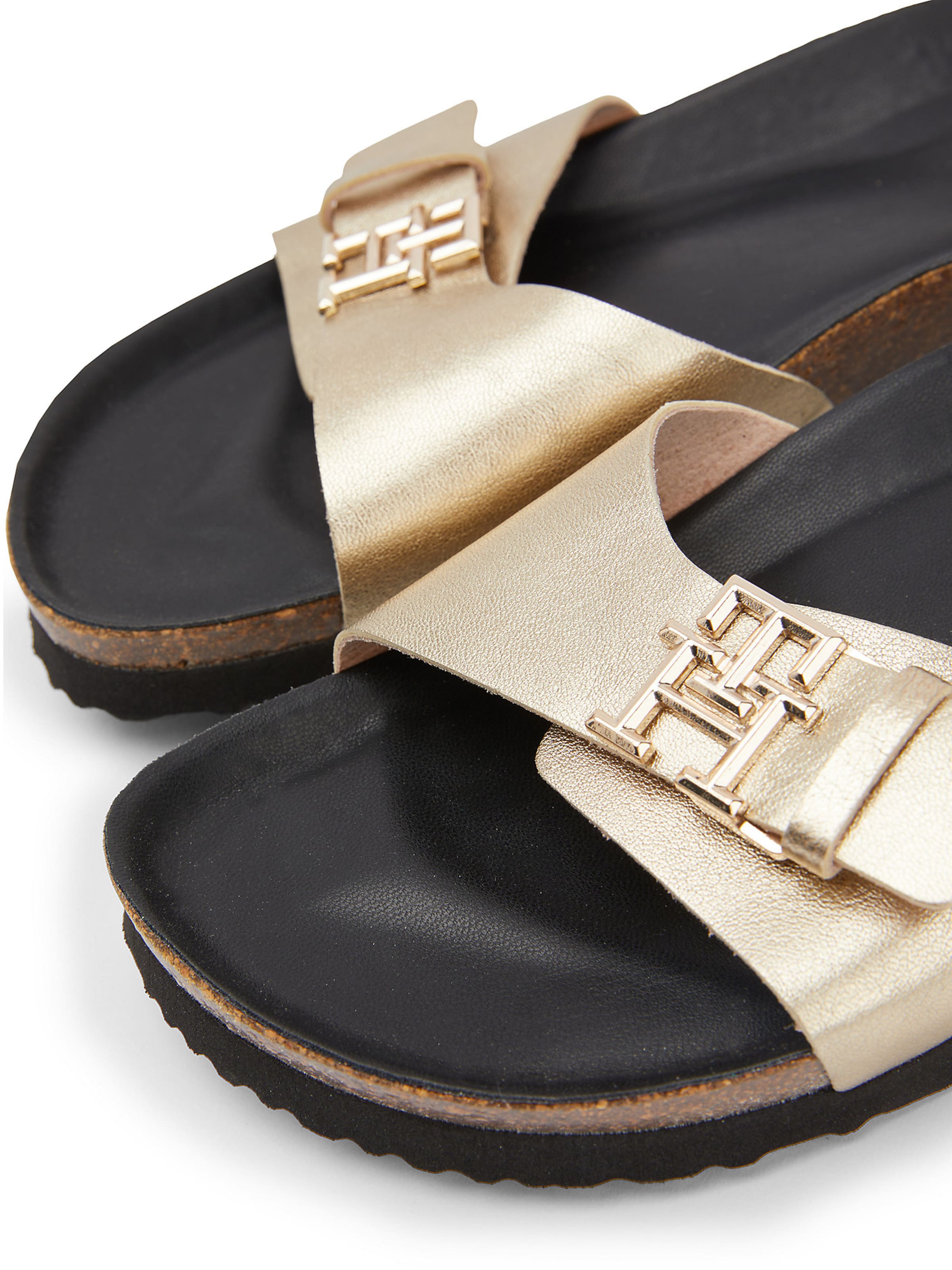 TOMMY HILFIGER Mules in Gold ABOUT YOU