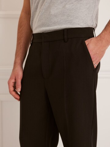 Guido Maria Kretschmer Men Regular Trousers with creases 'Julius' in Black: front